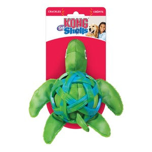 Green turtle-shaped KONG toy with packaging on a white background