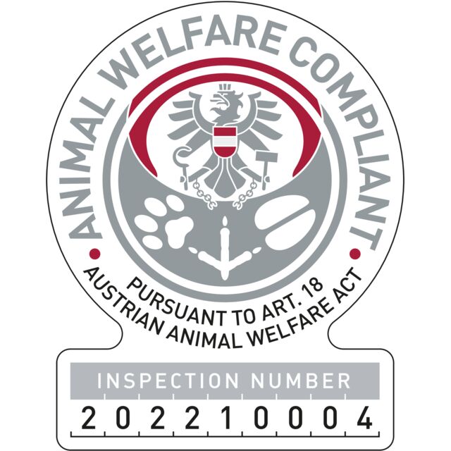 Animal welfare compliance sticker with inspection number on a white background