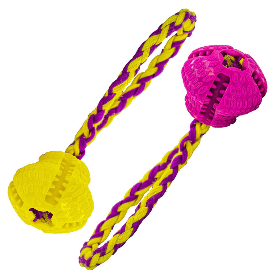 Pink and yellow dog toy with a rope on a white background