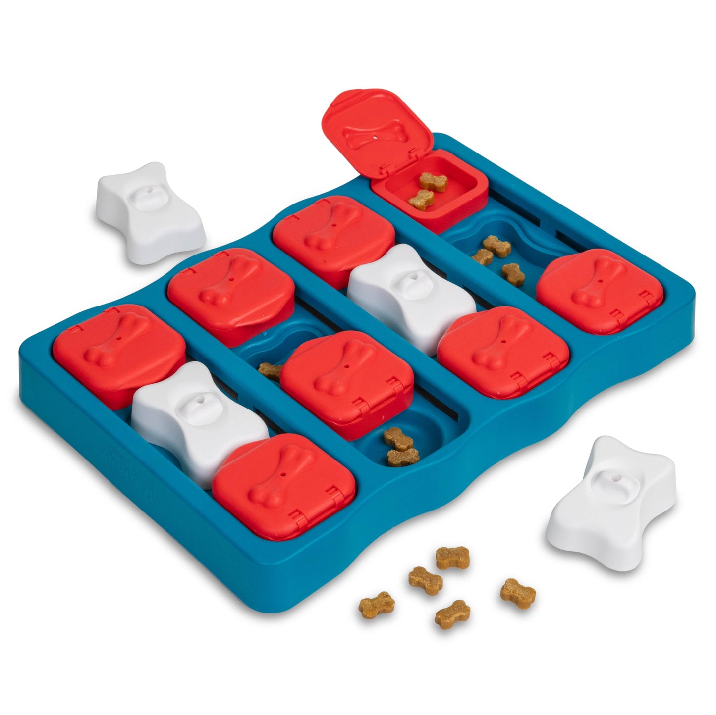 Dog treat puzzle toy with red and white paw prints on a blue tray, filled with dog treats.