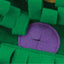 Close-up of green textured fabric with a purple heart shape