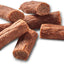 Brown dog treats on a white background