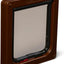 Brown pet door with a clear flap on a white background
