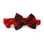 Red and black plaid bow tie on a red collar with a bell on a white background