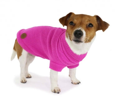 Dog wearing a pink sweater on a white background with a brand logo in the corner.
