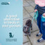 Dog on a leash with a person holding a treat pouch, promoting a product for dogs.
