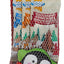 A packaged Christmas-themed sock in a mesh bag with a printed penguin design and holiday graphics. The header card reads 'Good Boy Real Meat Dog Stocking' and shows festive illustrations including a dog, Christmas tree, and sleigh.