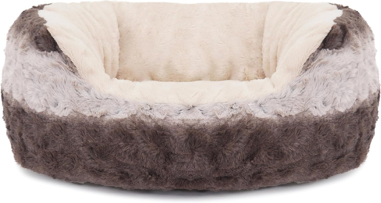 Fluffy pet bed with gray and beige fur on a white background