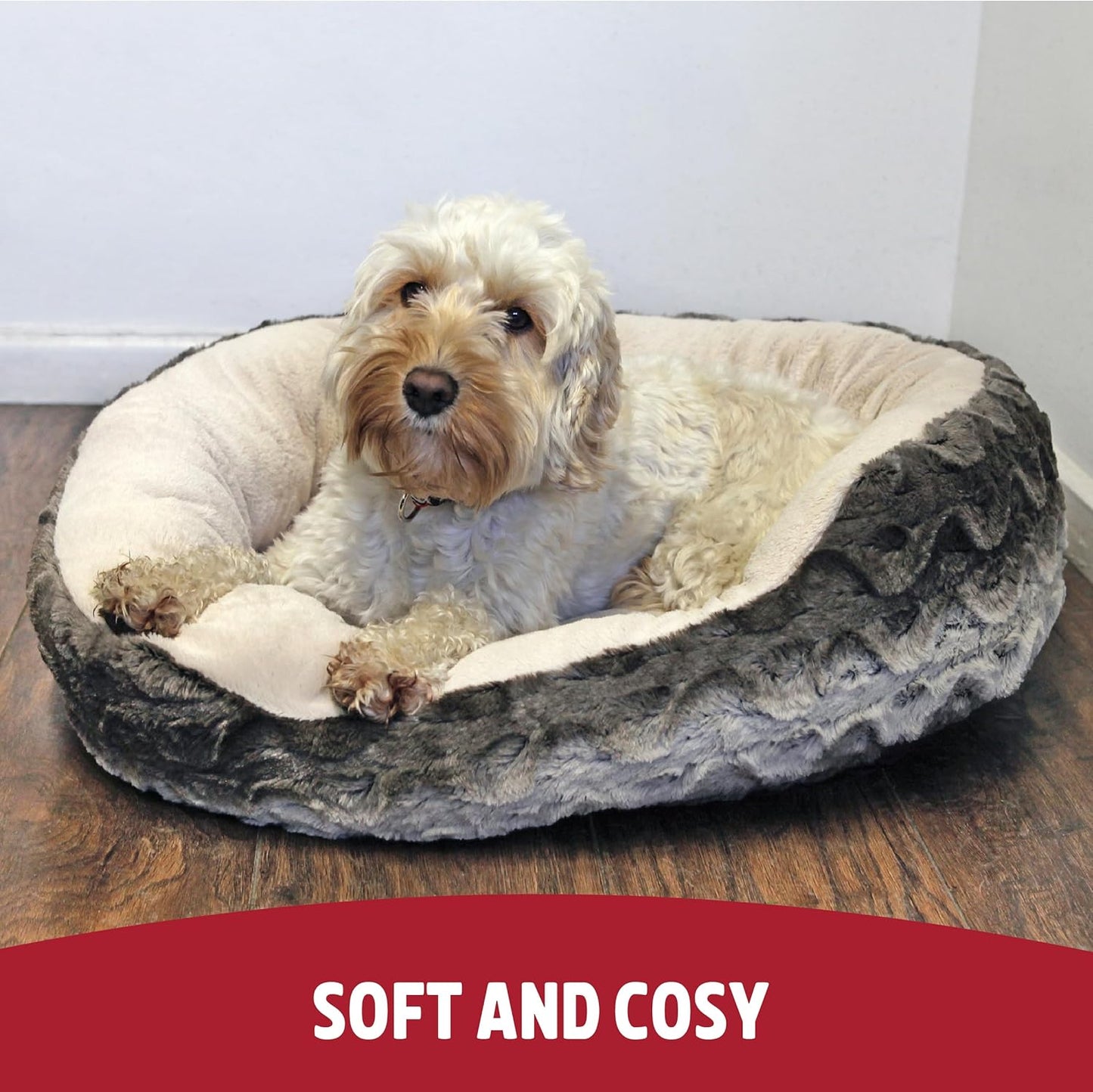 Dog lying on a soft and cozy pet bed with a red banner at the bottom.