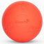 A bright orange-red hard dog toy ball with embossed dog silhouettes and the brand name 'Coach' in the center, shown on a clean white background.