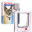 A white Cat Mate electromagnetic cat flap with a picture of a Siamese cat on the packaging and a remote control visible in the foreground.