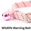 Pink cat collar with a bell and Ancol branding on a white background