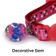 Pink cat collar with decorative gem and star pattern on a white background