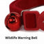Red cat collar with a bell labeled 'Wildlife Warning Bell' on a white background
