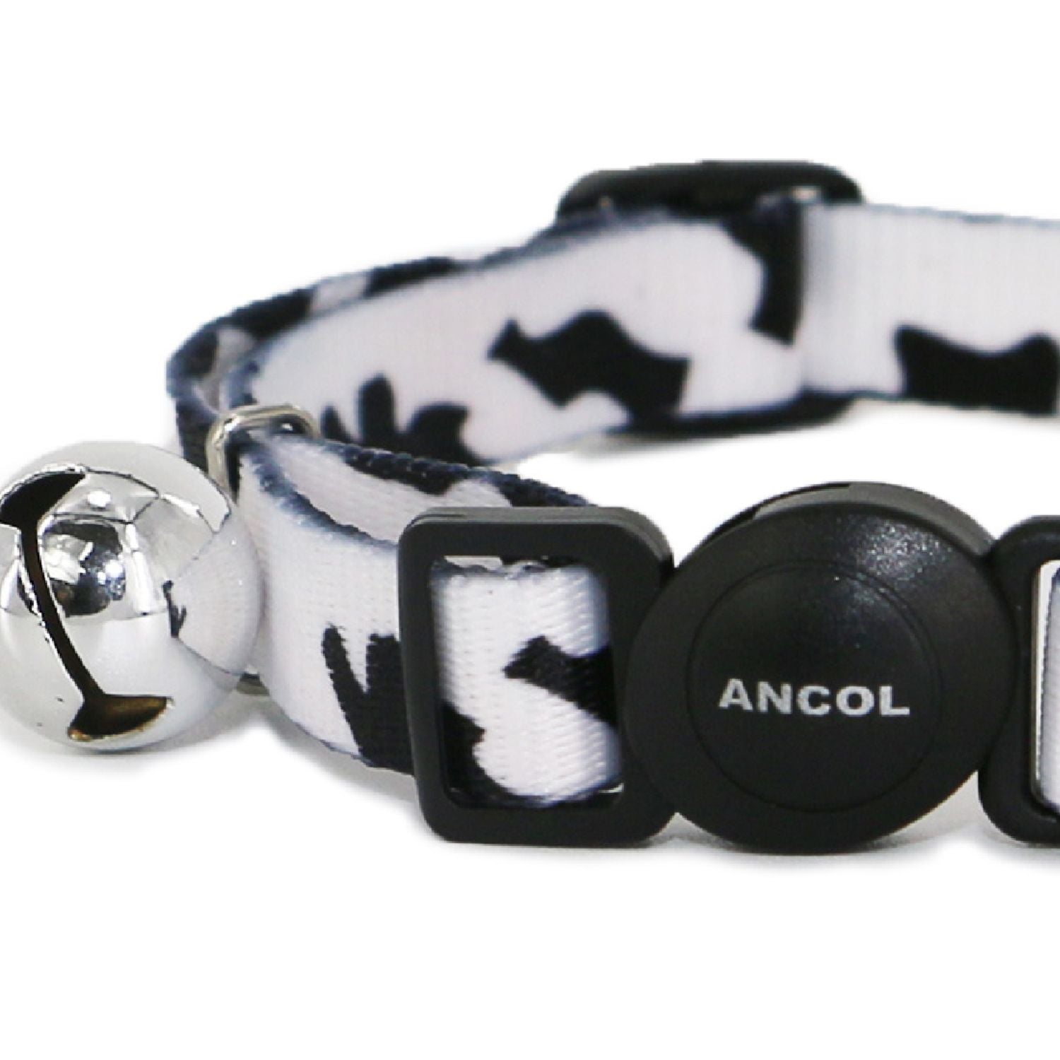 Cat collar with bell and black and white pattern on a white background