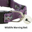 Purple cat collar with a white bell and 'Wildlife Warning Bell' text on a white background