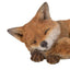 Sleeping fox figurine on a white background