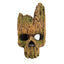 A skull-shaped decorative sculpture with a weathered wood texture, featuring green moss-like details and hollow eye sockets, isolated on a white background.