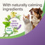 Promotional graphic for calming pet supplement ingredients, featuring a white cat and a brown dog on a white and purple background with text reading 'With naturally calming ingredients' and 'With calming herbs Fast acting' alongside illustrated herbs.