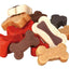 Assorted dog treats in bone and heart shapes on a white background