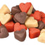 Assorted heart-shaped dog treats on a white background