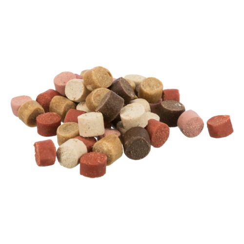 Assorted colored pet treats on a white background