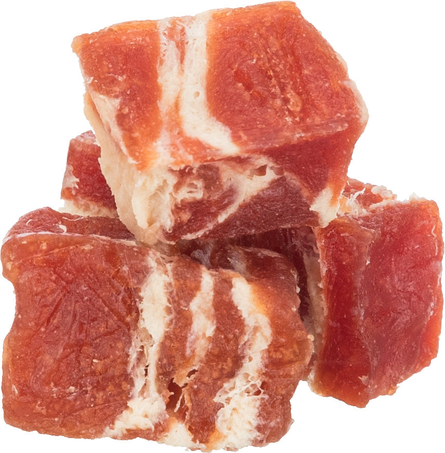 Cubes of marbled red meat dog treats on a white background