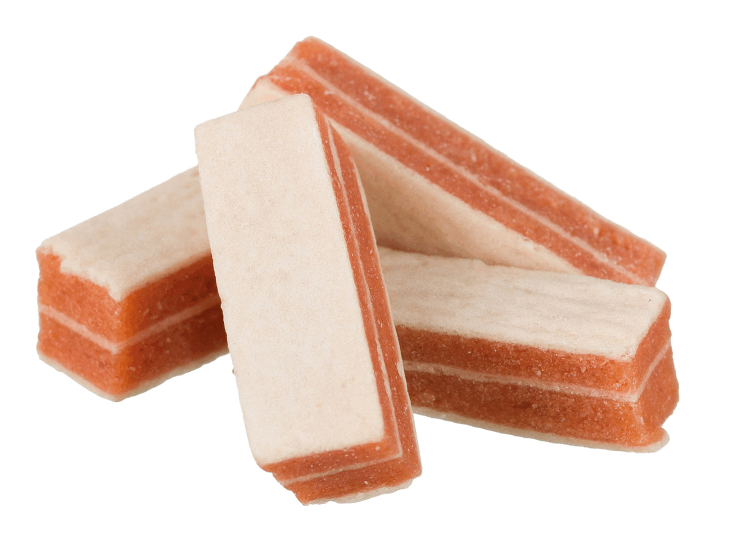 Stack of layered dog treats on a white background