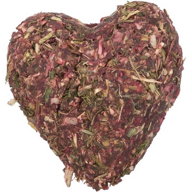 Heart-shaped small animal treat made of dried herbs on a white background
