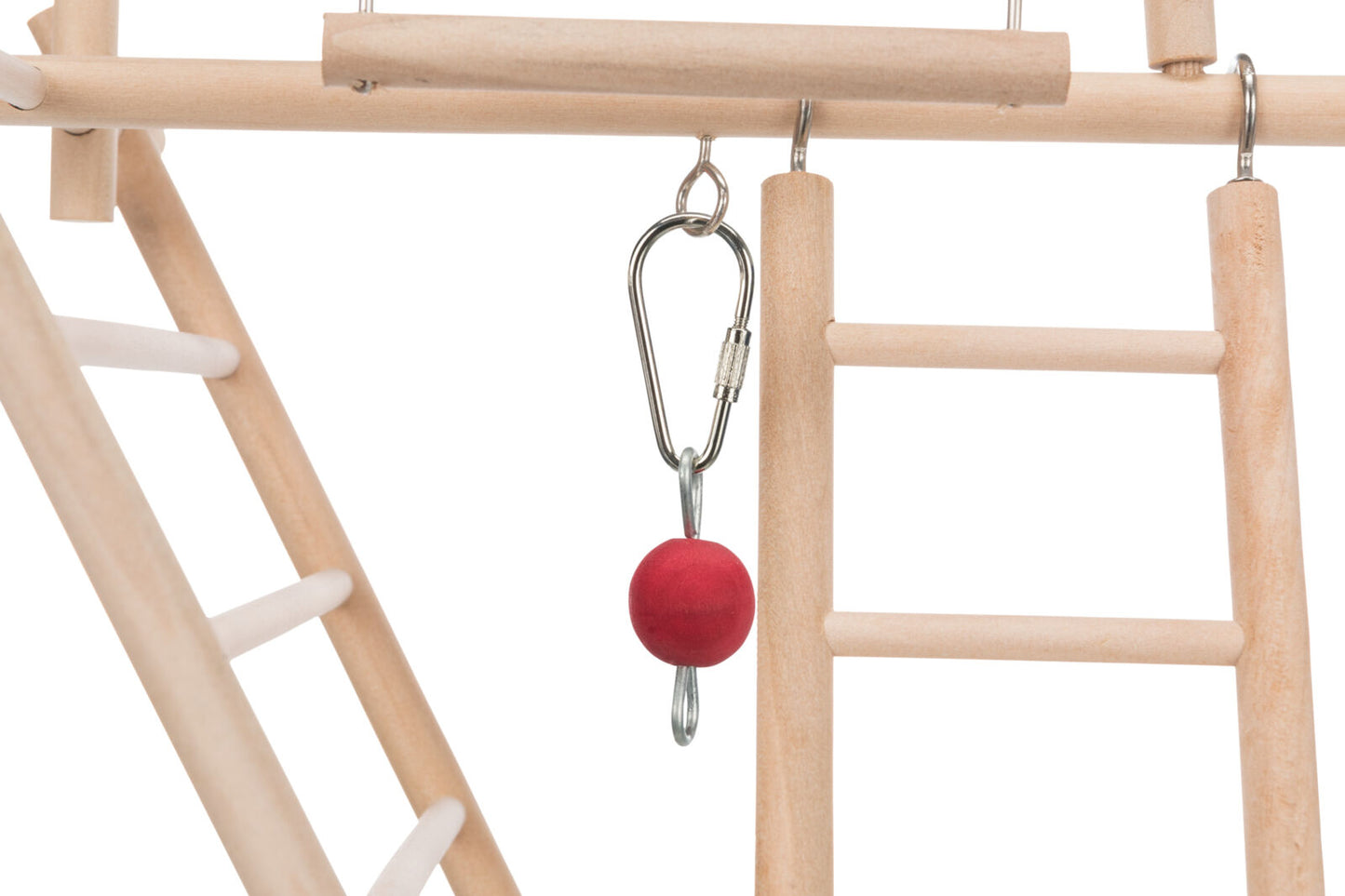 Red ball attached to a metal clip on a wooden climbing structure