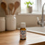 Bottle of Allergy Aid on a speckled countertop
