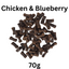 Dog treats labeled 'Chicken & Blueberry' with a weight of 70g on a white background