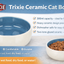 Trixie ceramic cat bowl with product features listed on a blue background