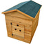 A wooden dog kennel with a gabled roof covered in dark green textured matting, featuring a front door with ventilation holes and a small brass latch, shown on a plain white background.