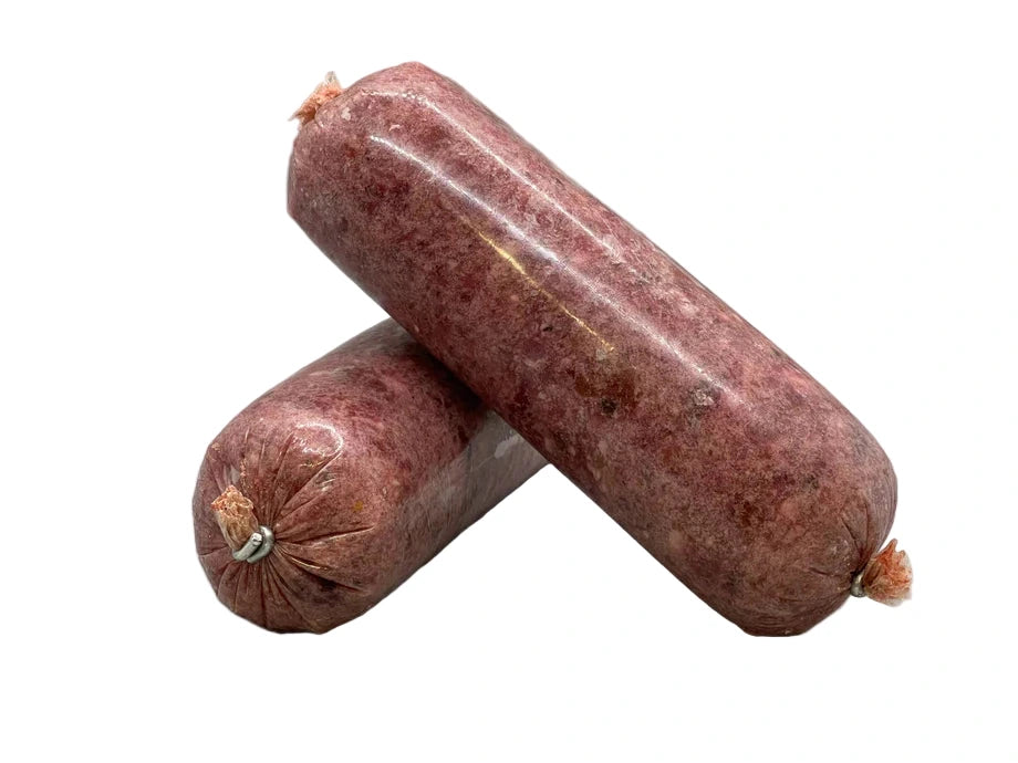 Two raw dog food sausages on a white background