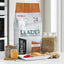 Red Mills Leader natural dog nutrition package on a kitchen counter with ingredients.