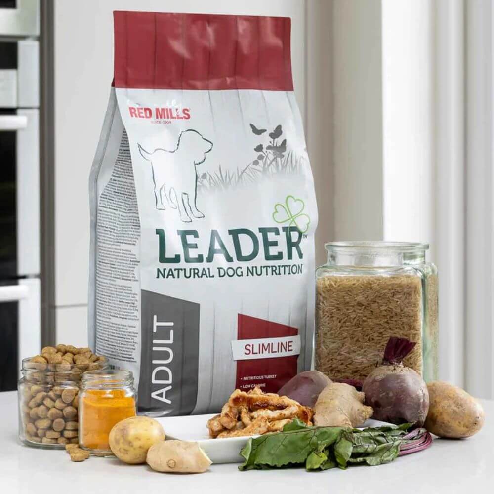 Red Mills Leader natural dog nutrition package with ingredients on a kitchen counter