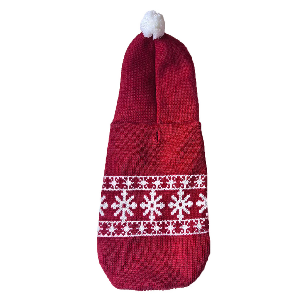Red knitted dog sweater with white snowflake pattern and pom-pom on a white background