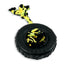 Black tire-shaped dog toy with a yellow rope on a white background