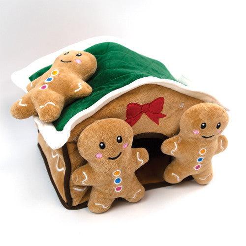 Plush dog toy house with gingerbread men on a white background