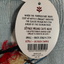 Tag on a dog sweater with text and a barcode, featuring the brand 'Sötnos'.