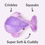 Purple plush dog toy fish with text indicating features like crinkles, squeaks, and softness on a white background.
