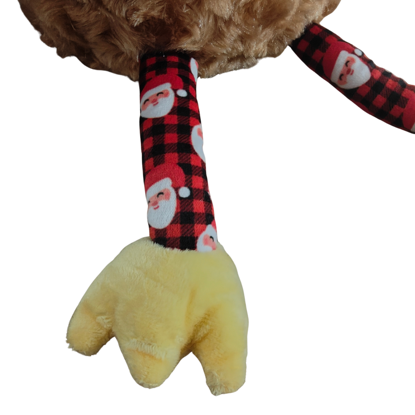 Plush dog toy with plaid arm and yellow paw on a white background
