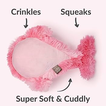 Pink plush dog toy with text indicating features like crinkles, squeaks, and softness on a white background.