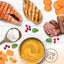 Assorted foods including salmon, chicken, beef, sweet potatoes, and a bowl of soup on a white background with 'Low Fat' label.