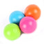 Four colorful balls dog toys (blue, orange, pink, green) on a white background