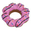 Pink donut-shaped cookie dog toy with sprinkles on a white background