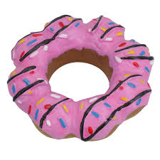 Pink donut-shaped cookie dog toy with sprinkles on a white background
