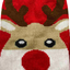 Knitted reindeer dog jumper with red background