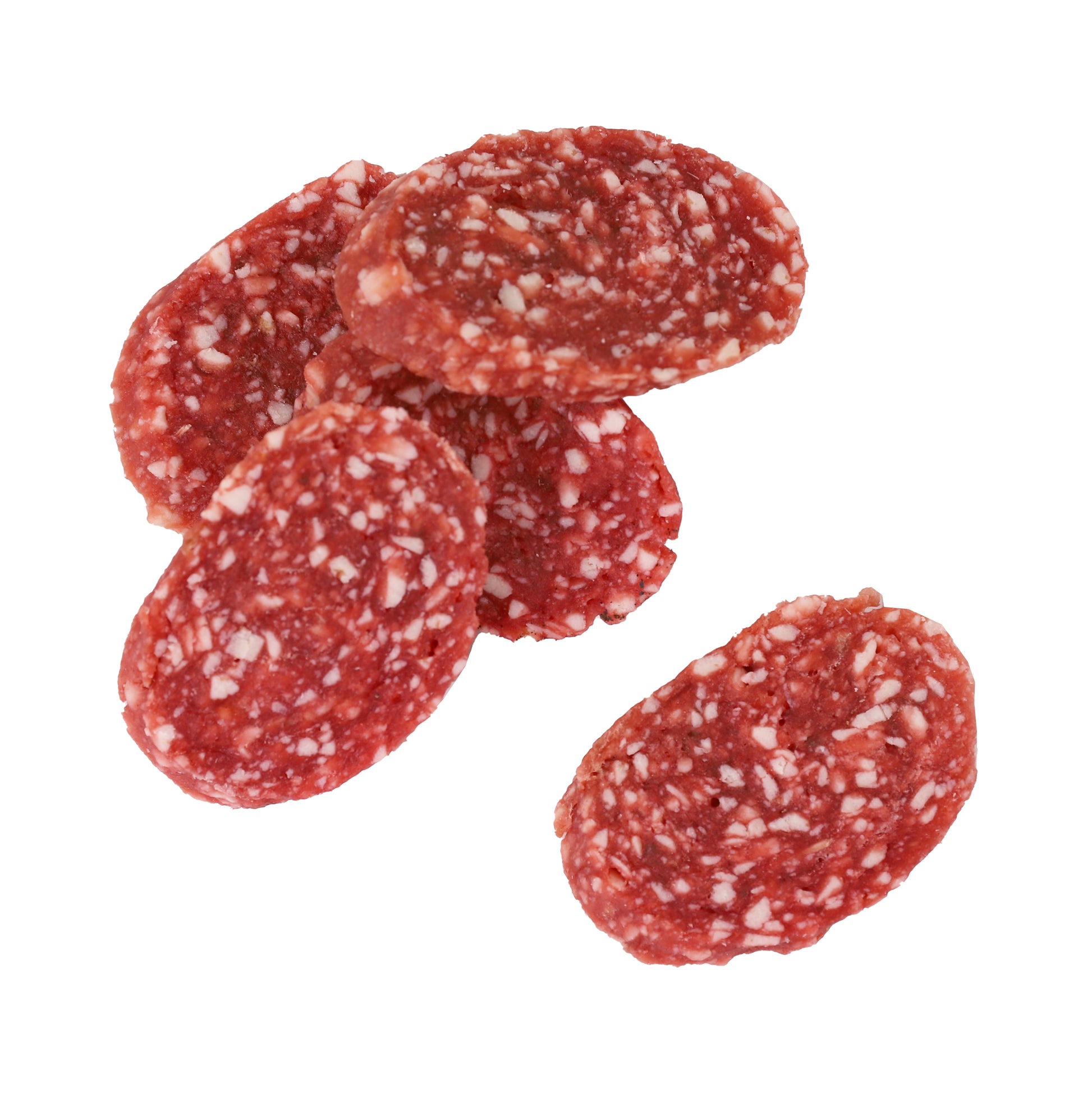 Slices of salami dog treats on a white background